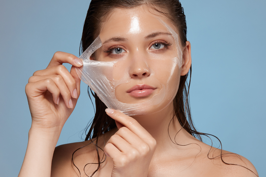 Attractive woman removing moisturizing mask