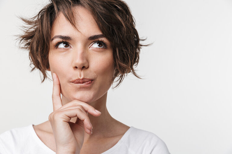 Beautiful young pretty thinking thoughtful woman