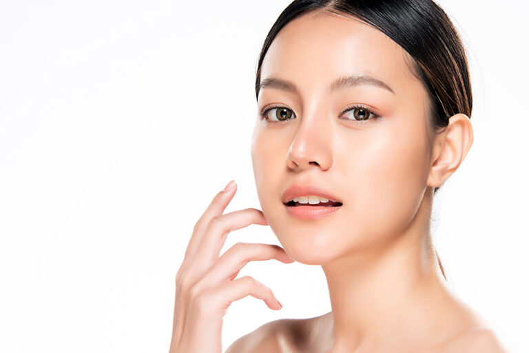 Beautiful Young Asian Woman with Clean Fresh Skin