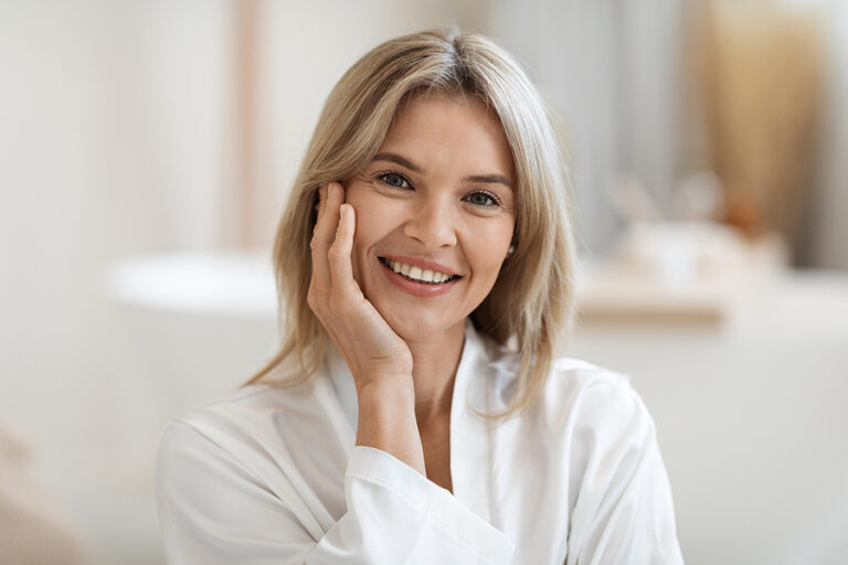 Portrait of smiling beautiful woman with smooth face skin