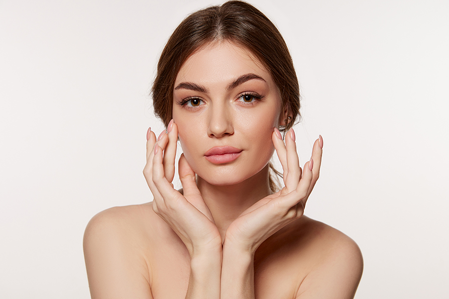 Portrait Of Young Beautiful Woman With Perfect Smooth Skin