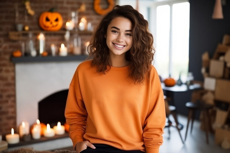 Pretty smiling model dressed with an orange mock up sweatshirt ,