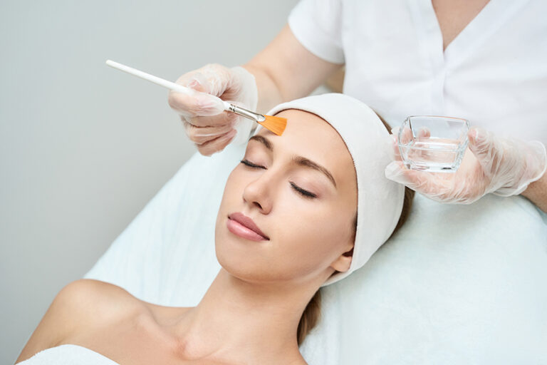 Young woman skin care facial chemical peel therapy