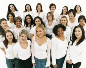 Group of women wearing white tops and jeans