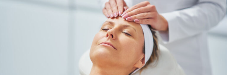 Young Nice Woman Having Face Massage In Spa