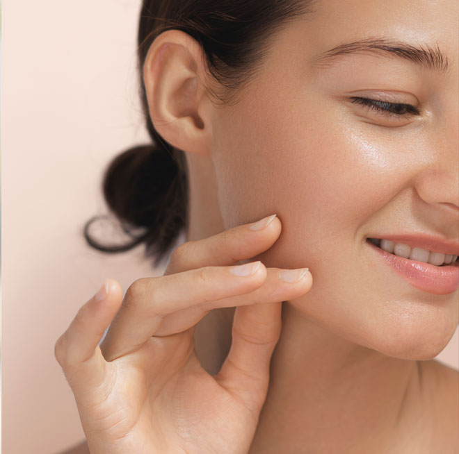 High-Quality Photo Of Skincare And Cosmetics Concept. Woman With Beautiful Face Touching Healthy Facial Skin Portrait. Beautiful Happy Asian Girl Model With Natural Makeup Enjoys Glowing Hydrated Skin